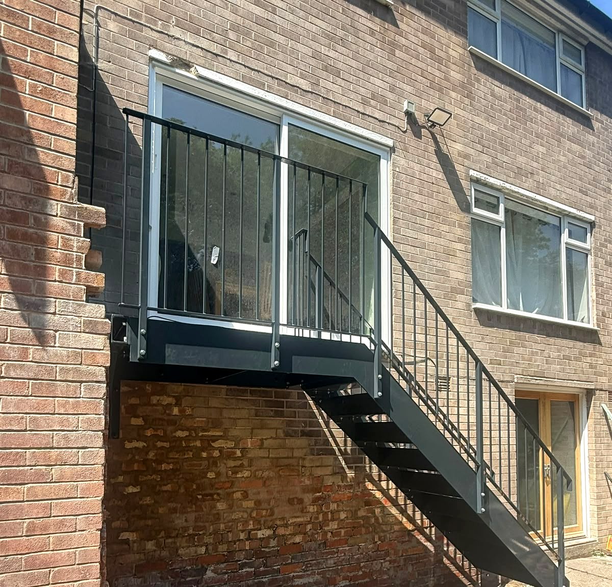 Square-bar metal balustrade and pressed-steel treads on an external staircase, Sheffield